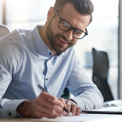 Man writing a checklist